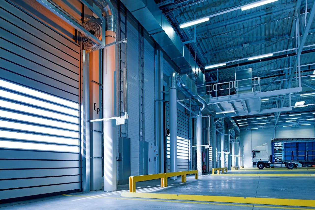 warehouse with a truck and multiple closed shutters